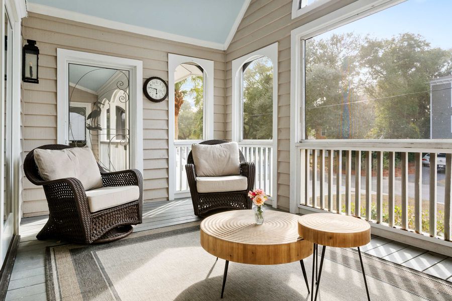 Front screened in porch area with plenty of seating for your group 