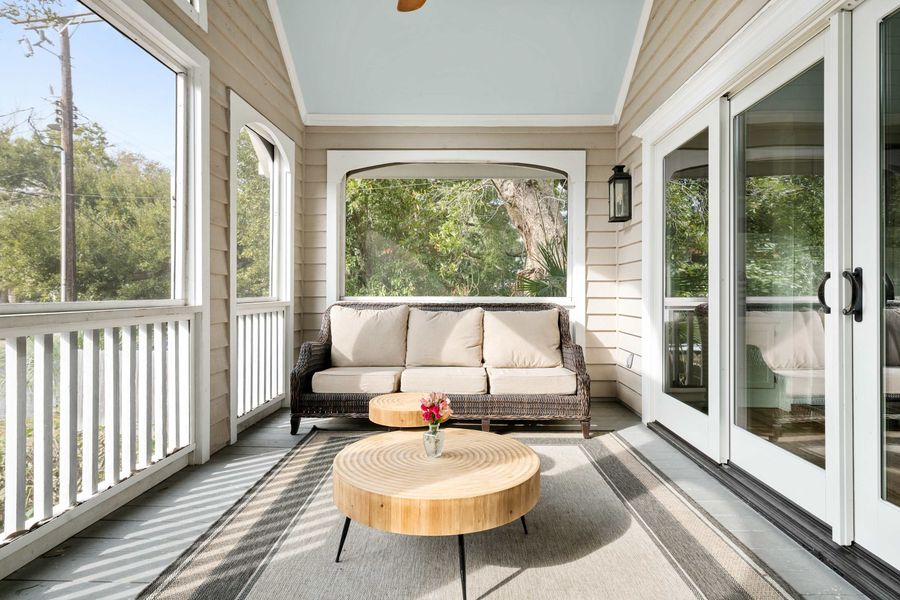 Front screened in porch area with plenty of seating for your group 