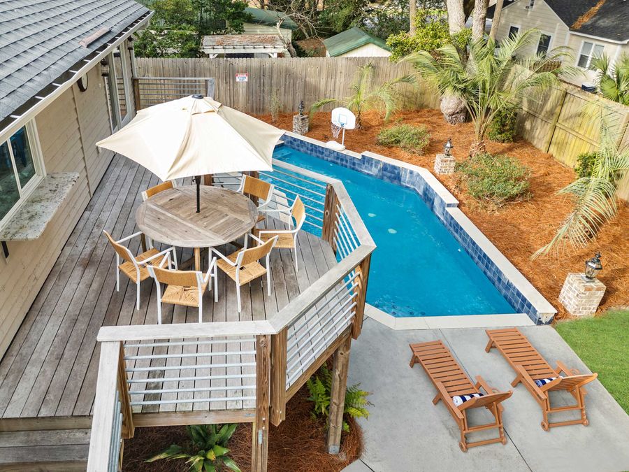 Outdoor oasis. There are is a back porch, pool area, front porch and two screened in porches all with seating for your group!