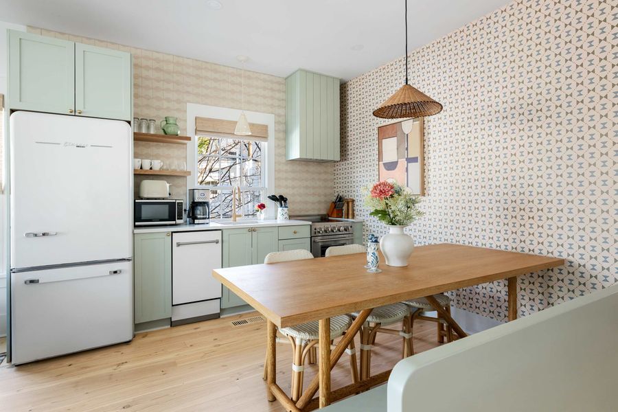 Fully equipped kitchen with dining seating area 
