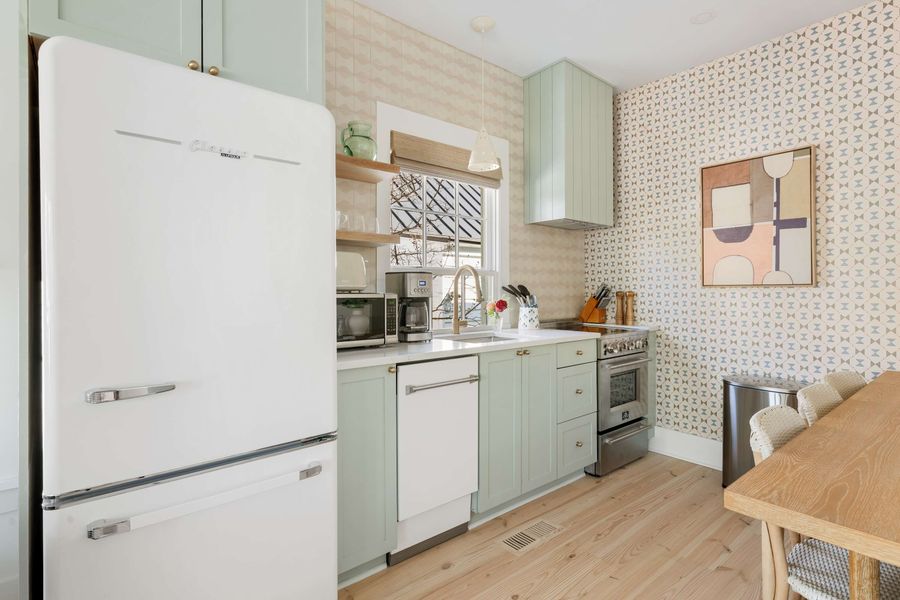 Fully equipped kitchen with dining seating area 