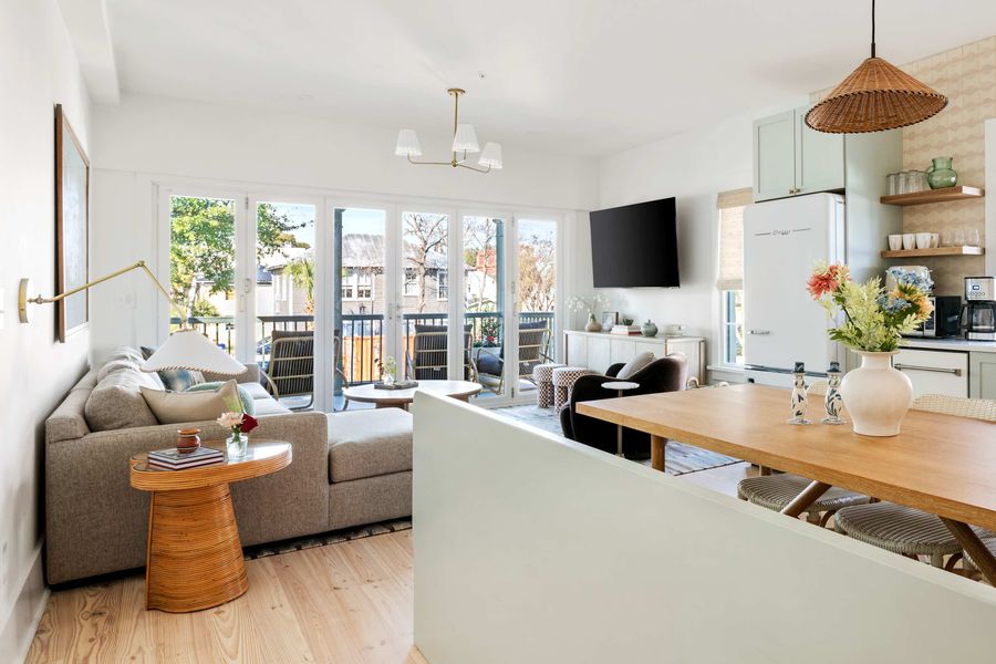 Spacious living room with folding doors that open to the porch 