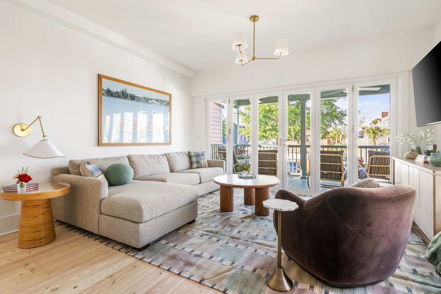 Spacious living room with folding doors that open to the porch 