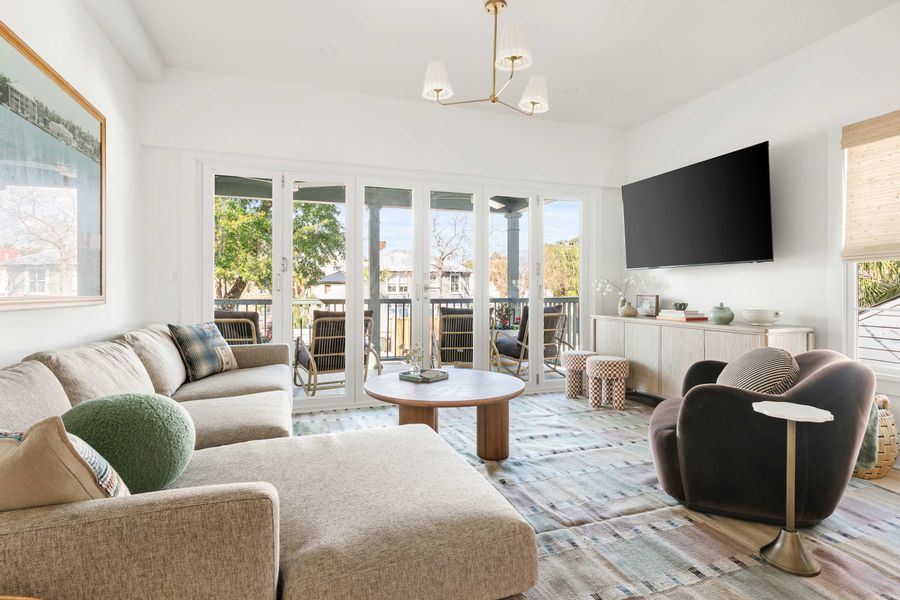 Spacious living room with folding doors that open to the porch 