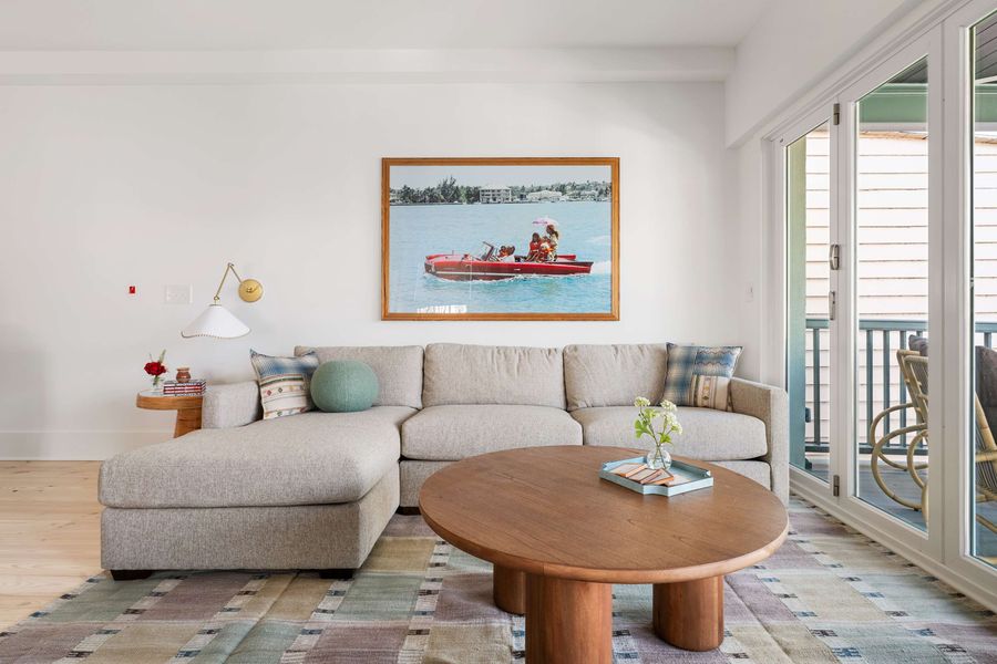 Spacious living room with folding doors that open to the porch 