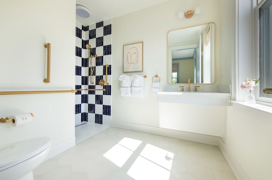 Luxury, huge Master bathroom with walk in shower. Sculptural finishes and soft, flattering light, designed for slow glam moments.