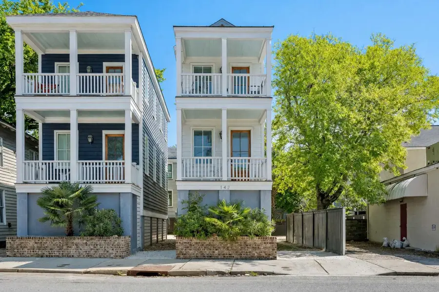 Exterior of your Downtown Charleston Home! Front porch with seating for your group! 