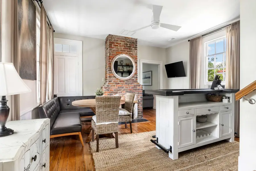 Spacious kitchen and dining space with a TV 