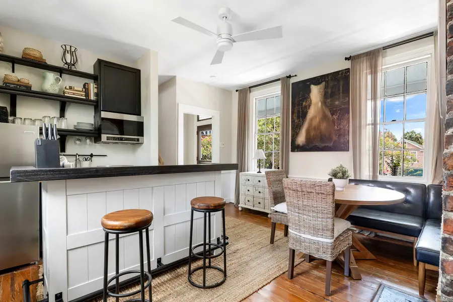 Spacious kitchen and dining space with a TV 