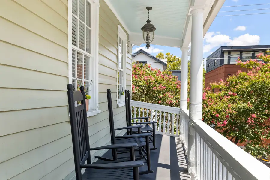 Upstairs porch seating with rocking chairs! 