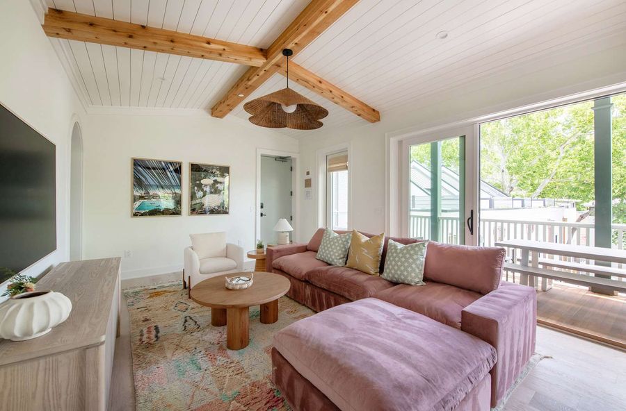 Open concept living space with huge sliding glass doors to the porch. Bring the outside in with this unique design!