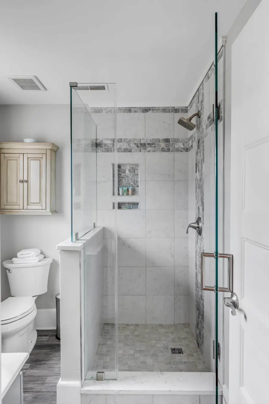 Bathroom 1: Modern bathroom featuring a spacious walk-in shower.
