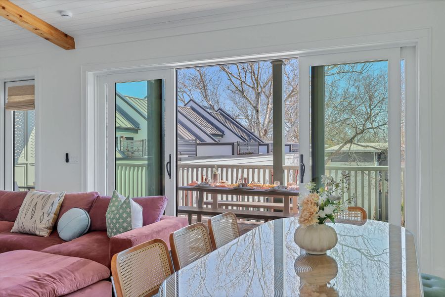 Open concept living space with huge sliding glass doors to the porch. Bring the outside in with this unique design!
