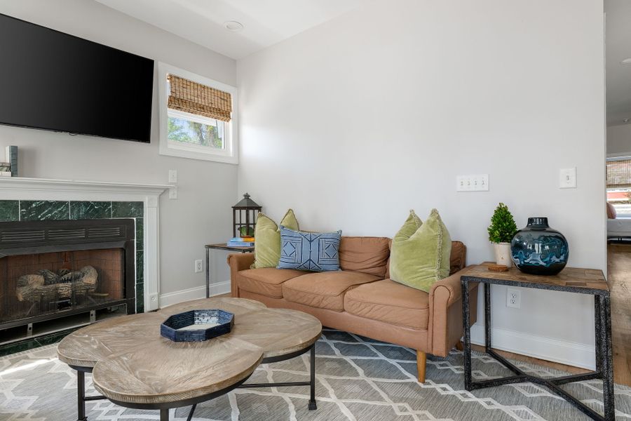 Unit A: Full Living Room with large porch and double doors.