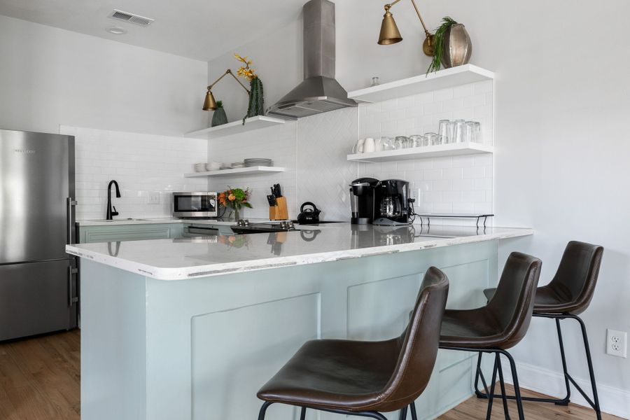Two full kitchens with bars and entertainment areas.