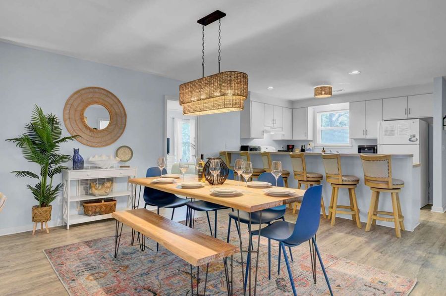 View of dining area and kitchen island with seating