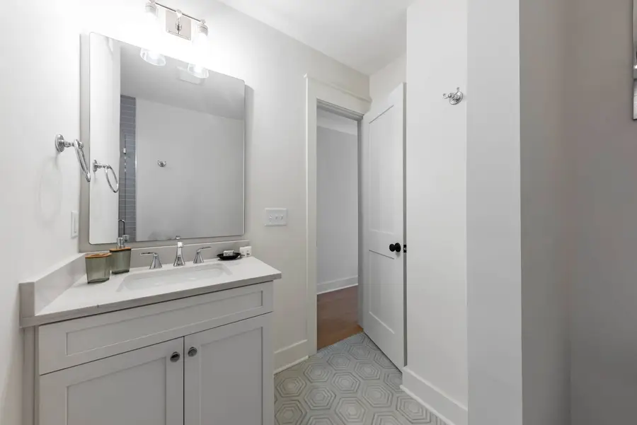 Bathroom 2: A well-appointed bathroom with a walk-in shower and modern finishes.