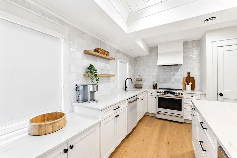 Cook, gather, and dine in the spacious kitchen featuring modern appliances and plenty of counter space.