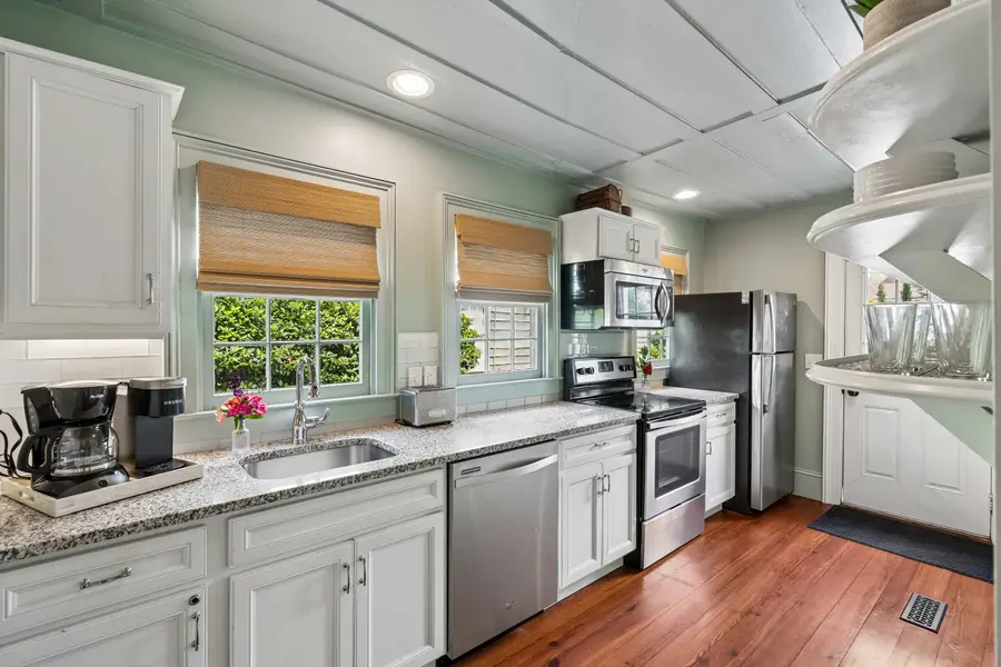 Thoughtfully appointed with modern appliances, generous natural light, and all the cooking and dining essentials, this kitchen makes every meal feel at home.