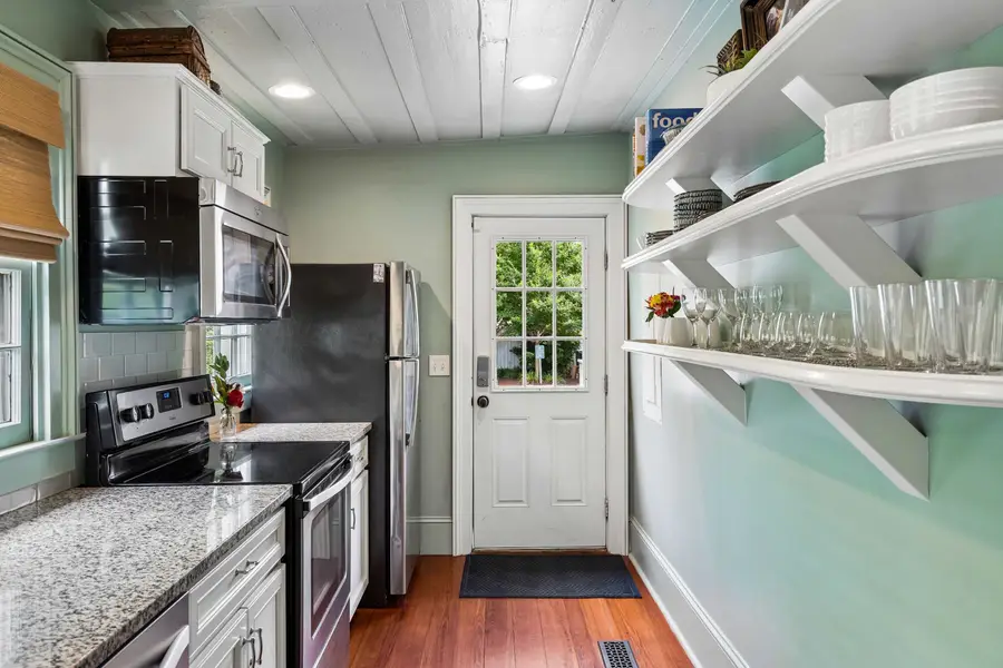Thoughtfully appointed with modern appliances, generous natural light, and all the cooking and dining essentials, this kitchen makes every meal feel at home.