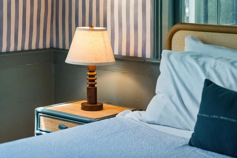 Bedroom #1: Features a king bed, Smart TV, abundant natural light, and a dedicated vanity/work desk for a comfortable and versatile stay.