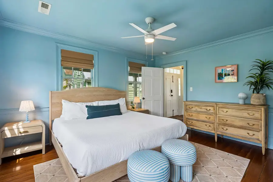 Bedroom #1: Features a king bed, Smart TV, abundant natural light, and a dedicated vanity/work desk for a comfortable and versatile stay.