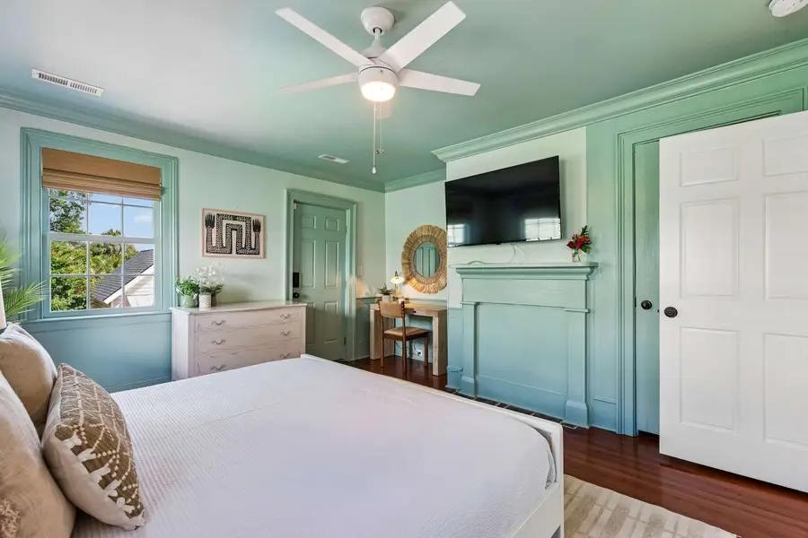 Bedroom #4: Designed with a king bed, Smart TV, beautiful natural light, and a stylish vanity that doubles as a workspace.