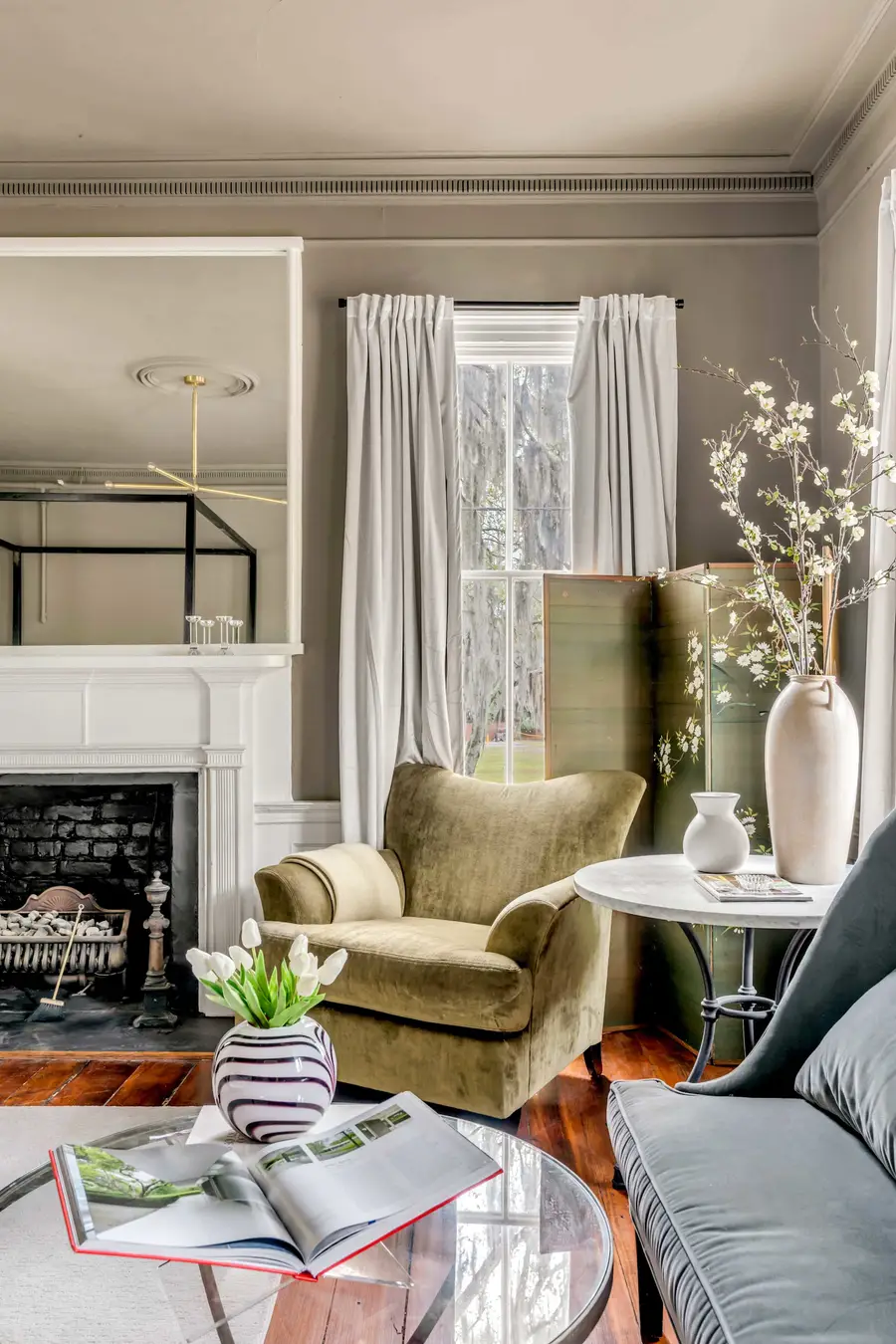 Bedroom #1: Bright, elegant, and inviting, this king suite offers a plush bed, cozy sofa, TV, and plenty of natural light for a truly relaxing stay.