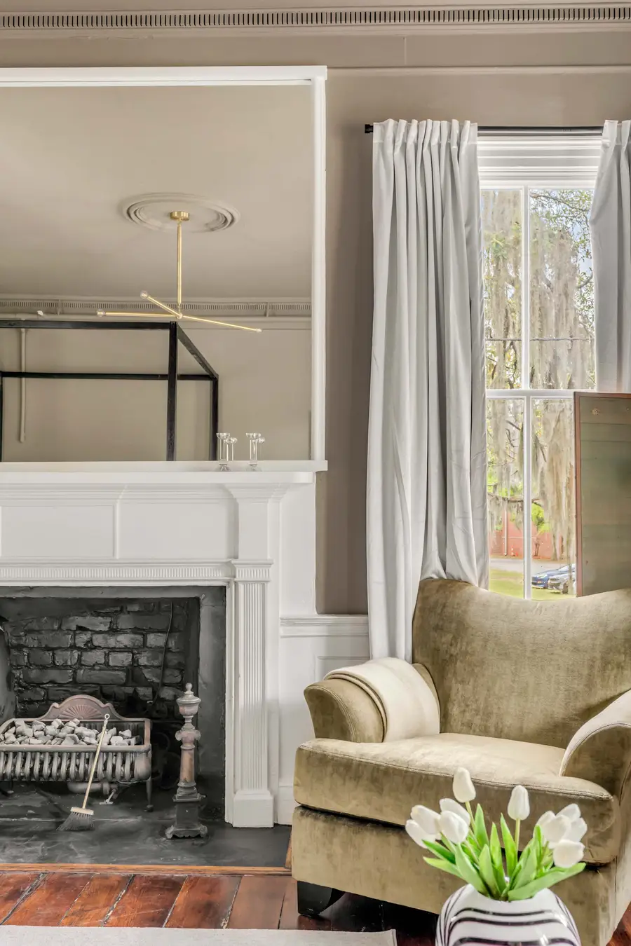 Bedroom #1: Bright, elegant, and inviting, this king suite offers a plush bed, cozy sofa, TV, and plenty of natural light for a truly relaxing stay.