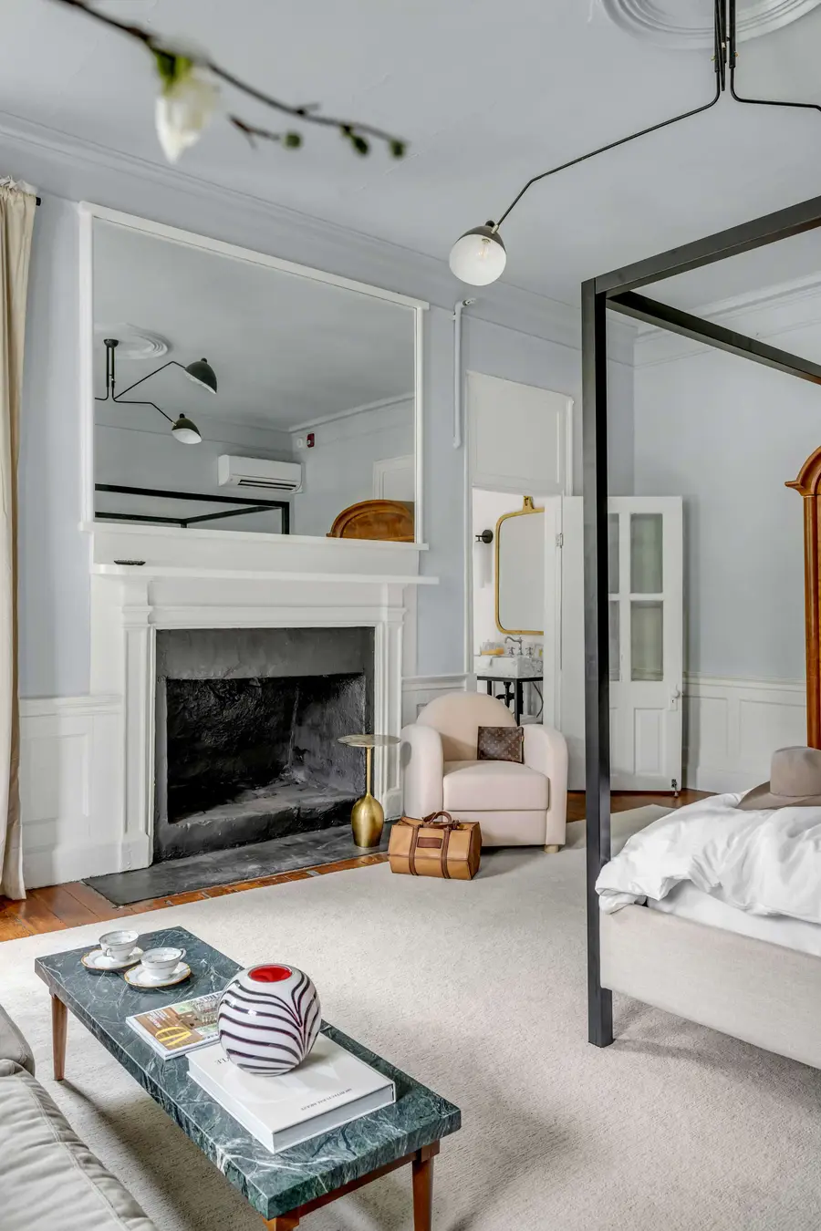 Bedroom #1: Bright, elegant, and inviting, this king suite offers a plush bed, cozy sofa, TV, and plenty of natural light for a truly relaxing stay.