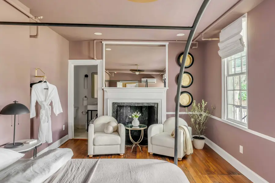 Bedroom #1: Unwind in a plush king bed with a private ensuite bathroom and a cozy sitting area for two, perfect for enjoying your morning coffee or relaxing after a day of exploring.