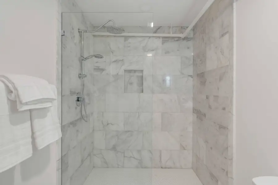 Bathroom #1: Refresh in your private ensuite bathroom featuring a spacious walk in shower and elegant finishes.