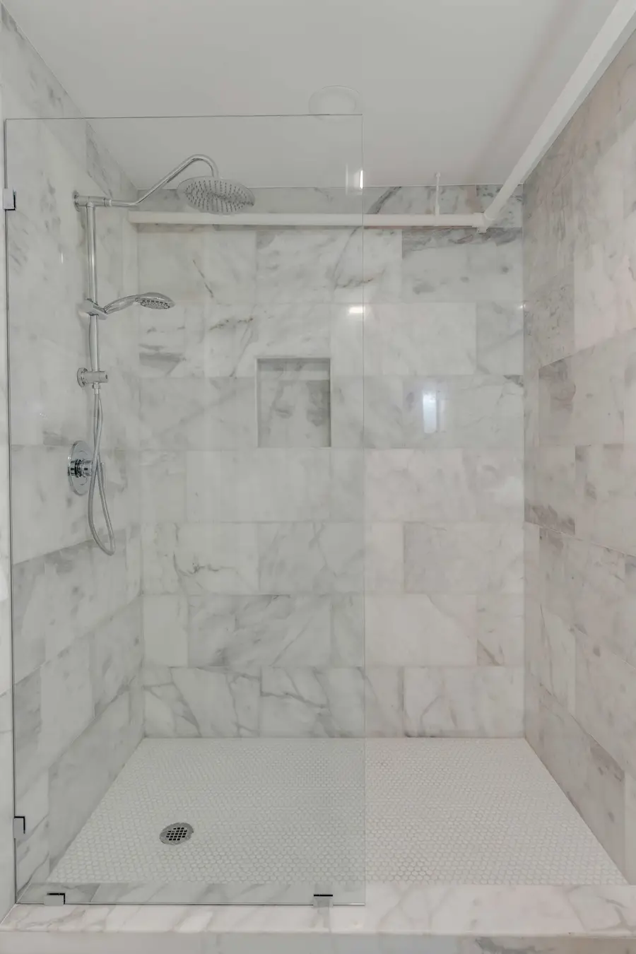 Bathroom #1: Refresh in your private ensuite bathroom featuring a spacious walk in shower and elegant finishes.