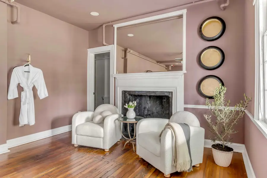 Bedroom #1: Unwind in a plush king bed with a private ensuite bathroom and a cozy sitting area for two, perfect for enjoying your morning coffee or relaxing after a day of exploring.