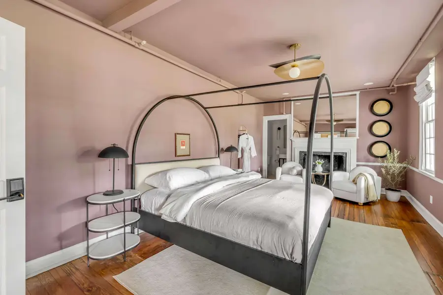 Bedroom #1: Unwind in a plush king bed with a private ensuite bathroom and a cozy sitting area for two, perfect for enjoying your morning coffee or relaxing after a day of exploring.