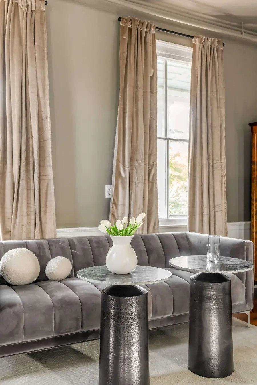 Bedroom #1: Bright, elegant, and inviting, this king suite offers a plush bed, cozy sofa, TV, and plenty of natural light for a truly relaxing stay.