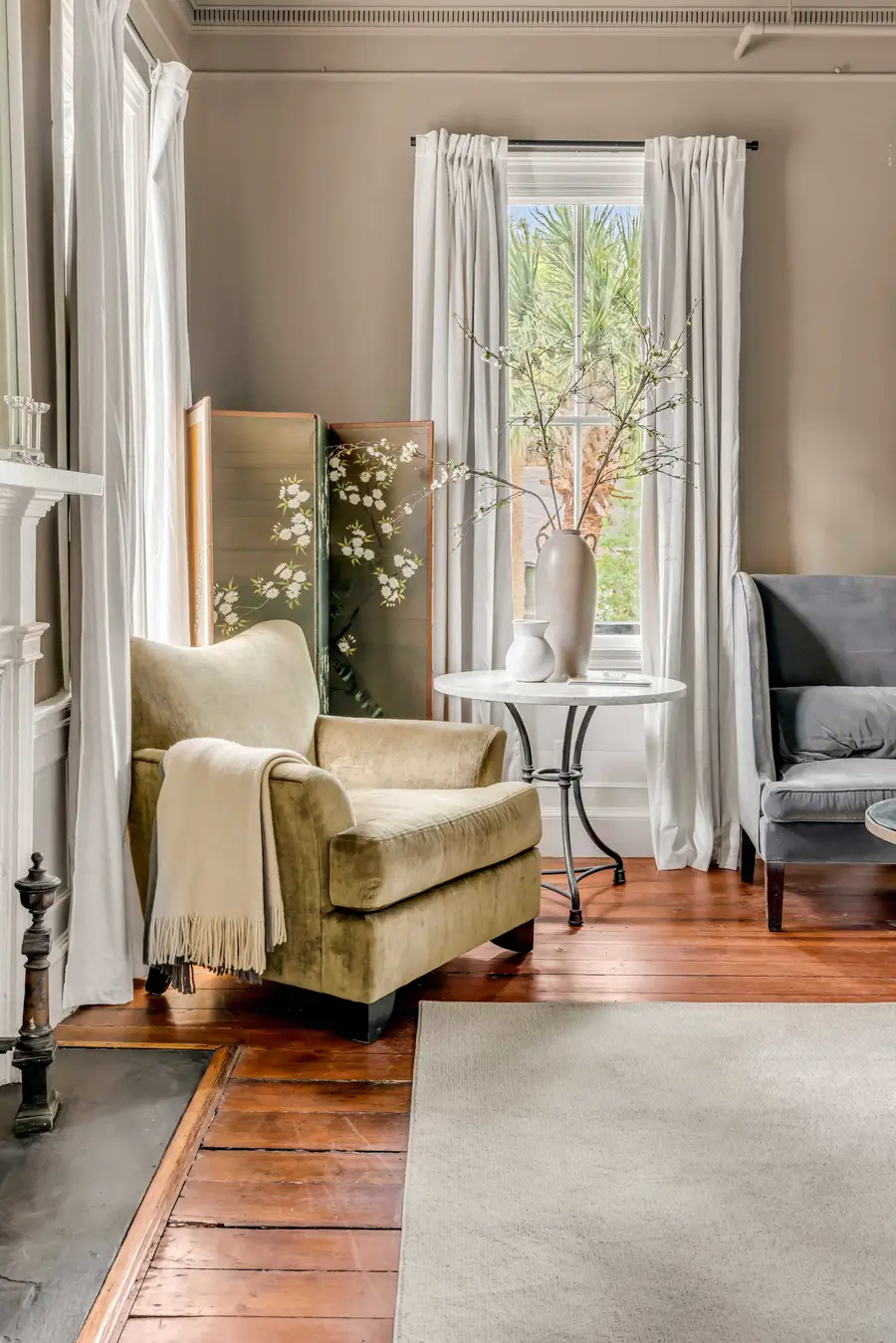 Bedroom #1: Bright, elegant, and inviting, this king suite offers a plush bed, cozy sofa, TV, and plenty of natural light for a truly relaxing stay.
