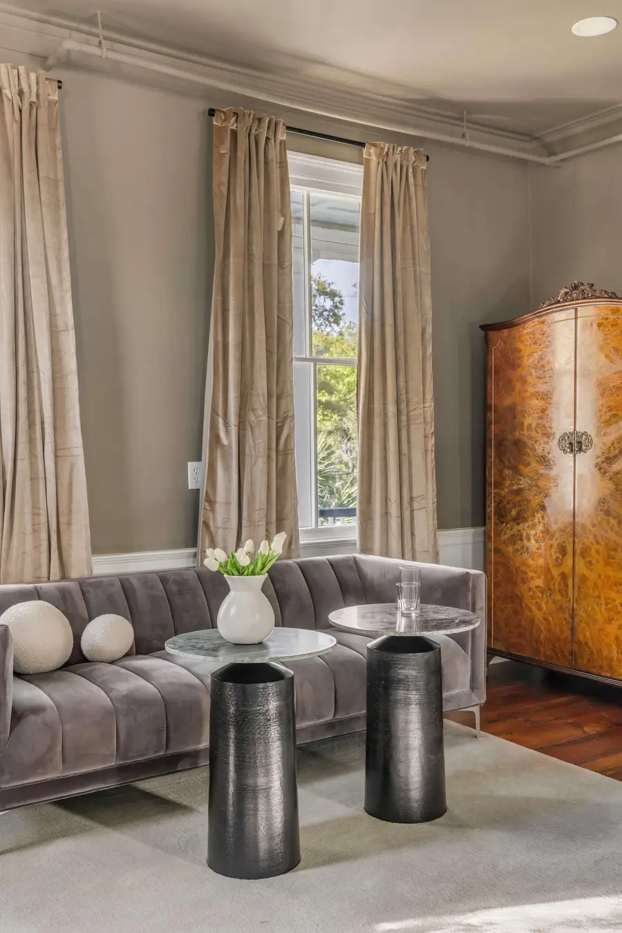 Bedroom #1: Bright, elegant, and inviting, this king suite offers a plush bed, cozy sofa, TV, and plenty of natural light for a truly relaxing stay.