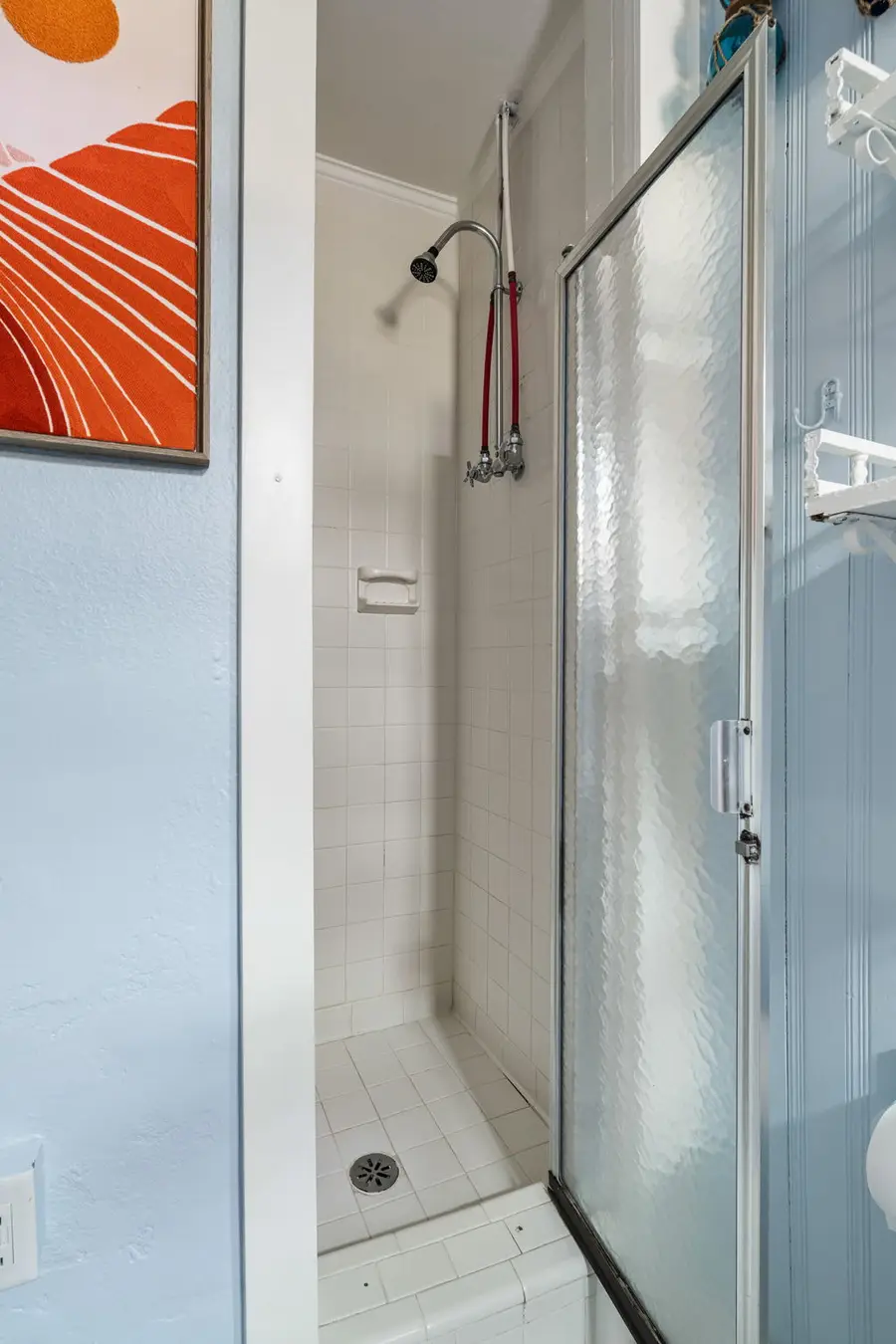 Bathroom #1: Offers a walk in shower and everything you need to refresh after a day at the beach.