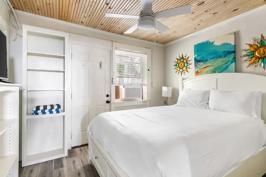 Bedroom #1: Features a plush king bed, offering a spacious and relaxing retreat after a day at the beach.