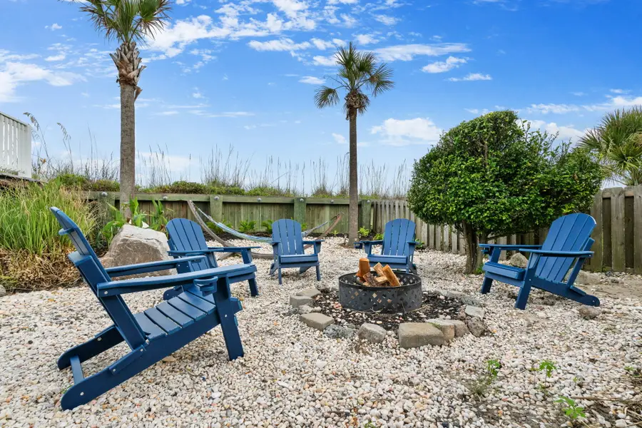 Gather around the fire pit with comfortable lounge chairs, perfect for cozy evenings under the stars.