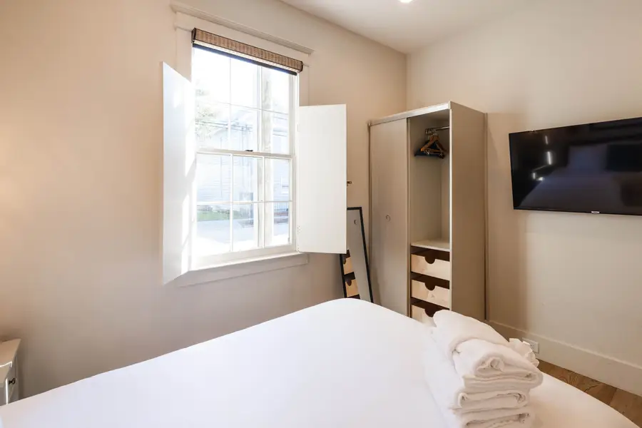 Bedroom 2: Queen Bed + TV