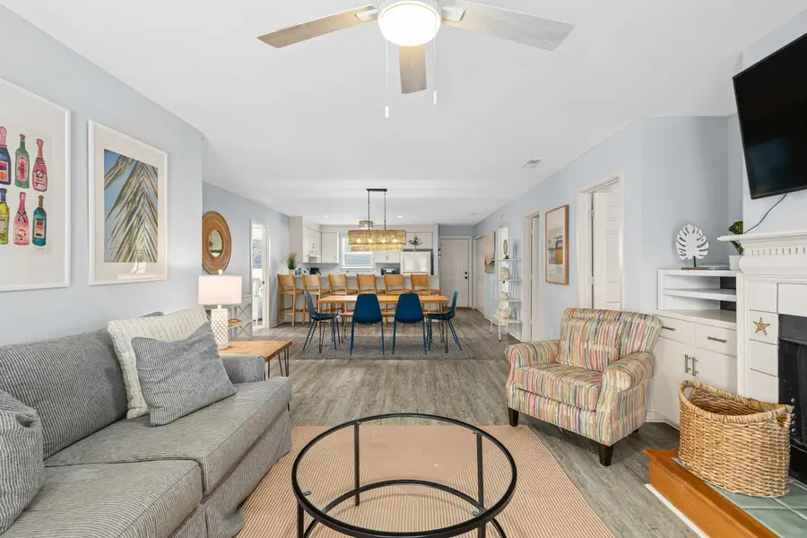 Spacious living room with a smart TV and plenty of seating 