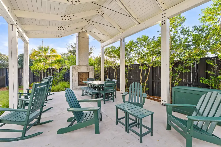 Soak up the sunshine by the sparkling shared pool or relax on the lounge chairs in this inviting outdoor retreat.
