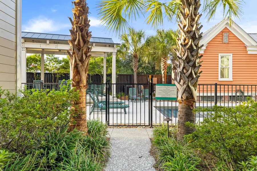 Soak up the sunshine by the sparkling shared pool or relax on the lounge chairs in this inviting outdoor retreat.