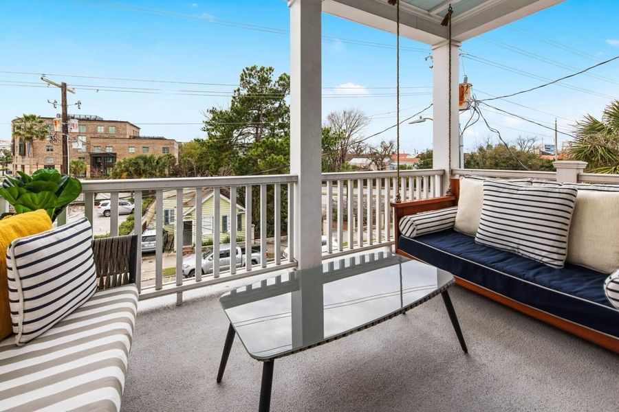 Outdoor seating space on top floor balcony