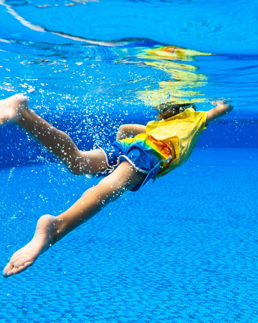 boy swimming spring break outer banks