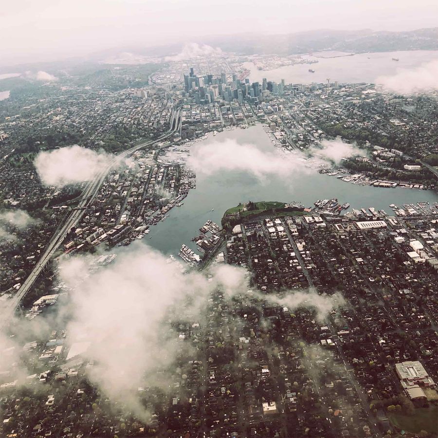 Arial view of Seattle, illustrating the thriving market for Seattle vacation rental management, with a panoramic view of the city skyline.